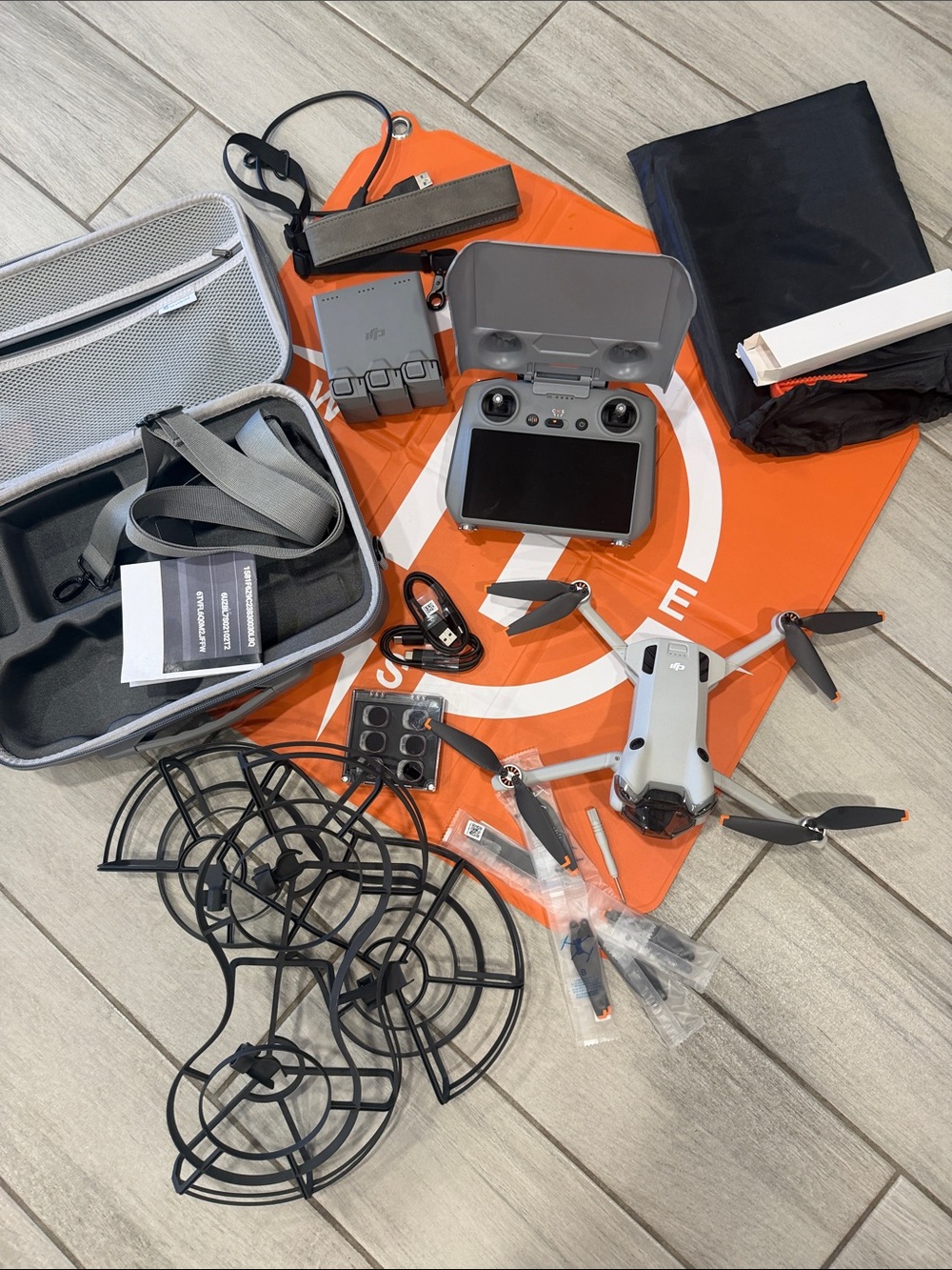 DJI MINI 4 PRO Foldable Drone Kit with Gray Controller and Orange Landing Pad